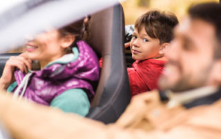 Small Boy in Backseat of Car, Needed Car Safety Features