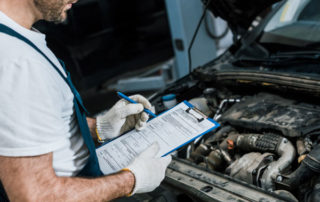 Photo of a Mechanic Performing Vehicle Inspections