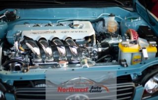 Photo of Car Engine with Northwest Auto Center Logo