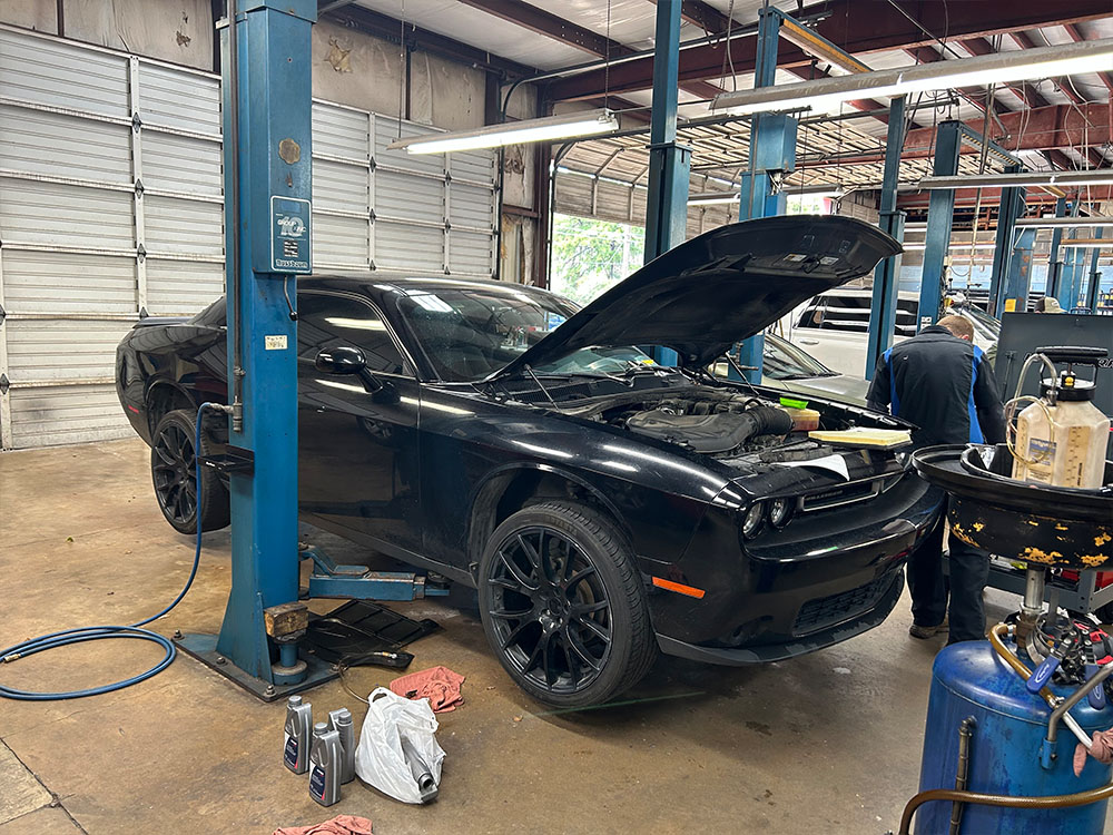 Image of Black Dodge Charger in Auto Shop