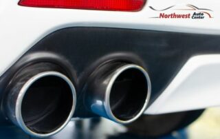 Image of Exhaust Pipe on Car with Northwest Auto Center logo